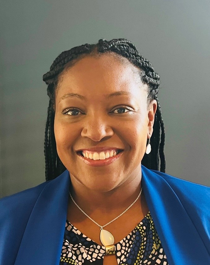 A person smiling for a pictureDescription automatically generated